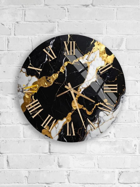 A round wall clock with a black and white marble design, featuring gold Roman numerals and hands.