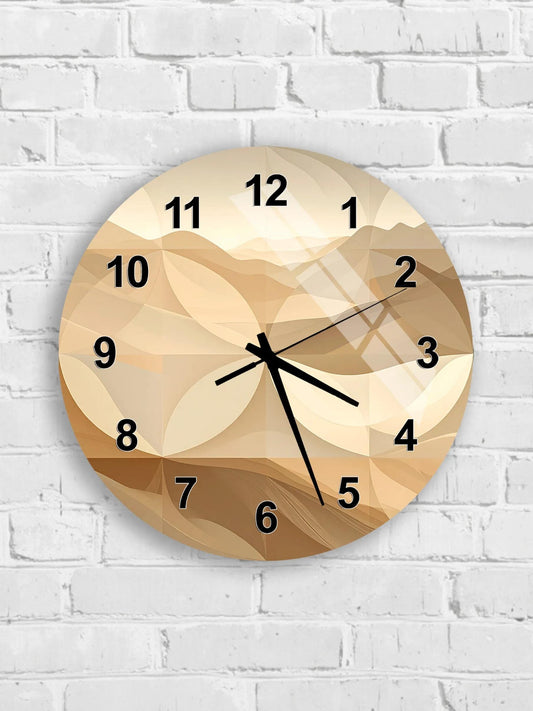 A wall clock with a beige and brown abstract design on its face, mounted on a white brick wall.
