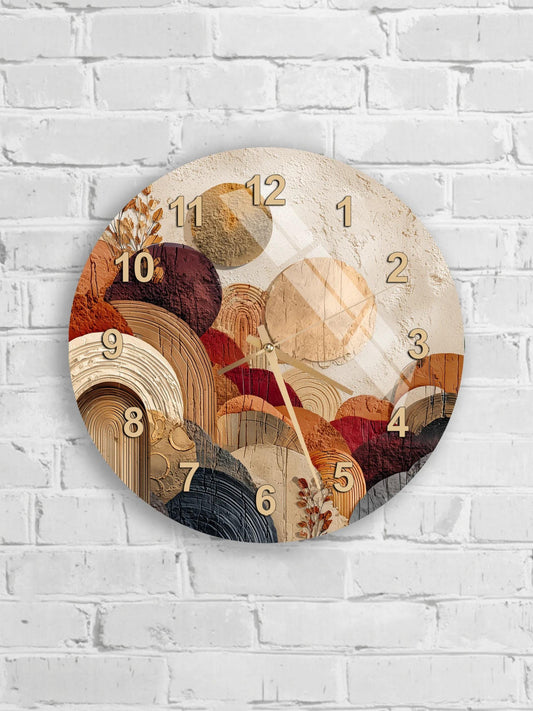 a round wall clock with a unique abstract design, mounted on a white brick wall.