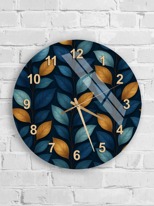 six round wall clocks with leafy leaf designs on a white brick wall.