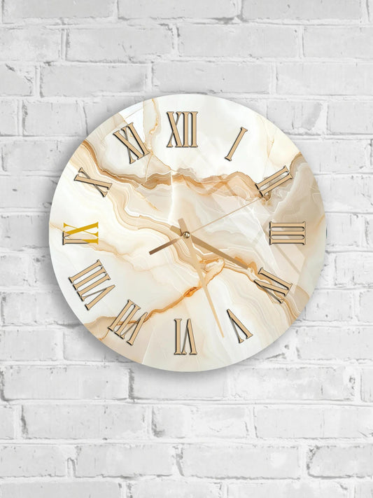 A round wall clock with Roman numerals is mounted on a white brick wall.