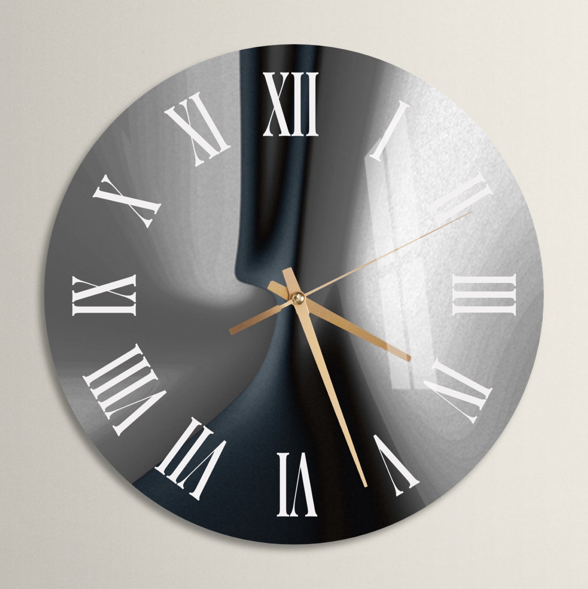 a black and white clock with roman numerals