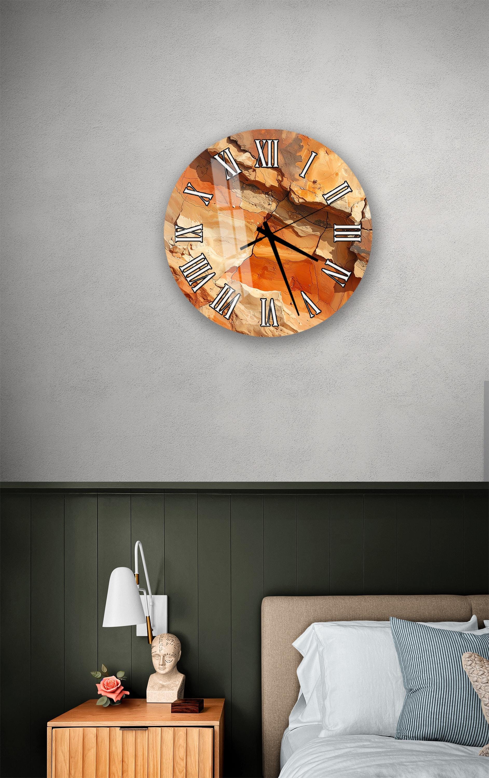 a bedroom setting with a wall clock, a nightstand, and a bed.