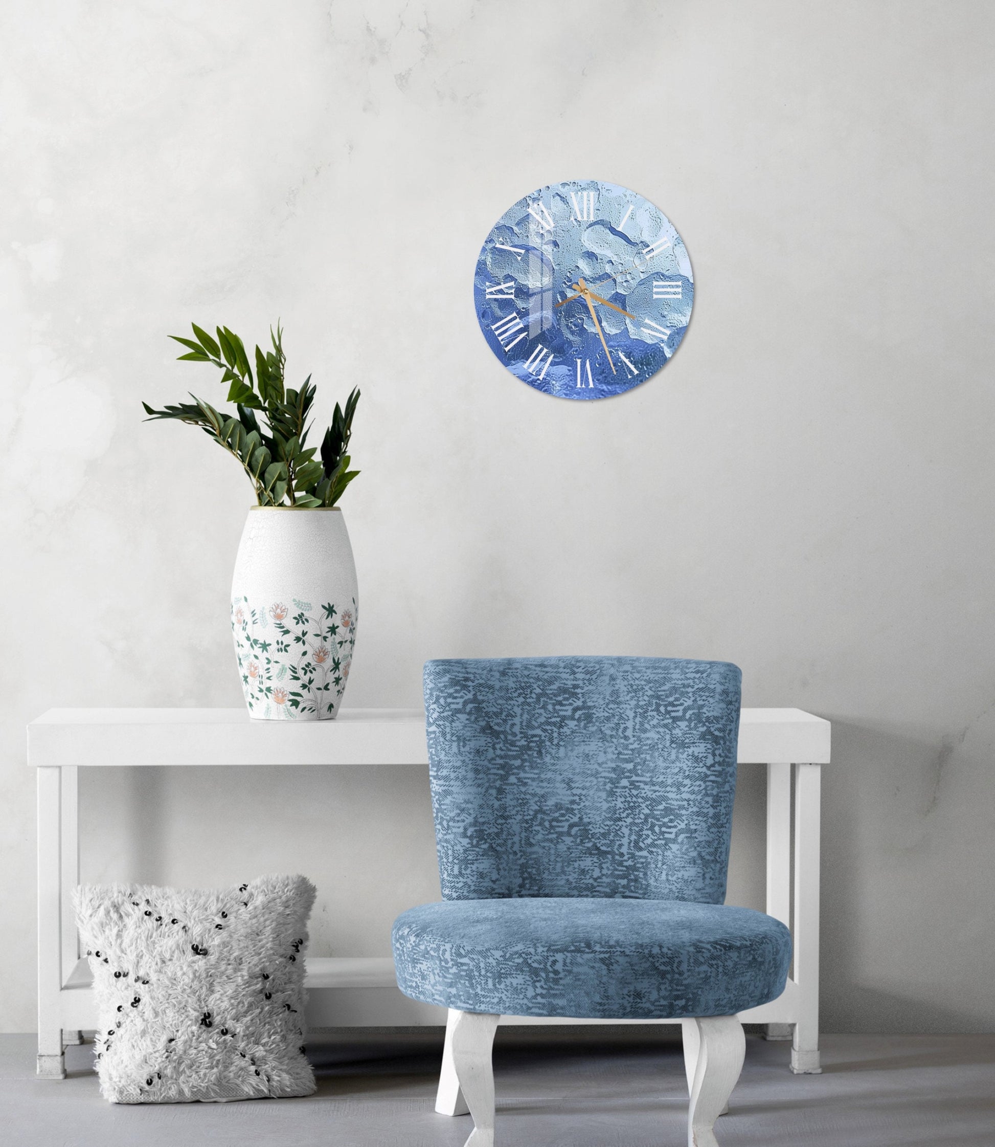 a blue chair sitting next to a white table