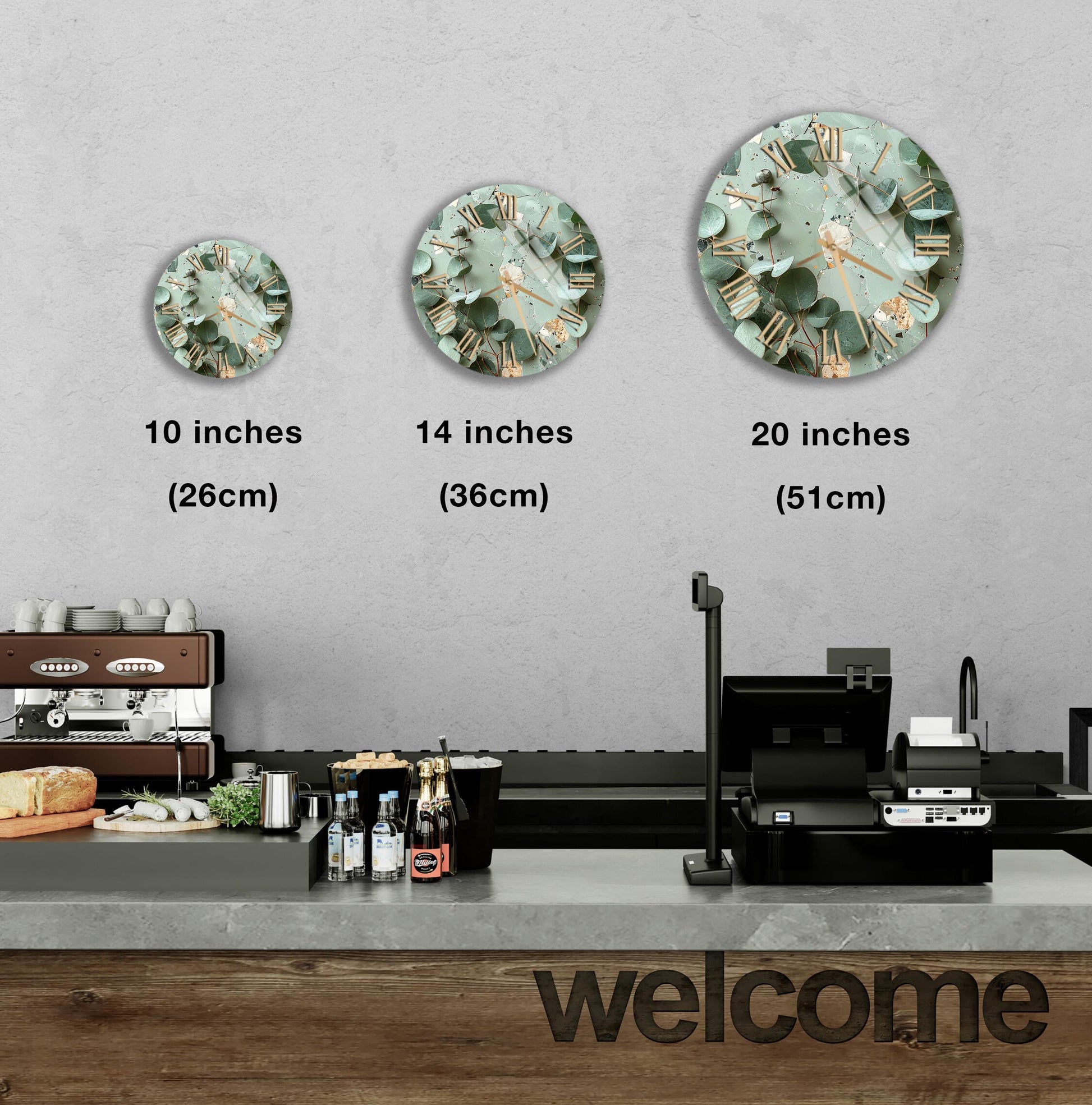 a counter with a cash register, a coffee machine, and a welcome sign. There are three clock images displayed on the wall, each representing a different size: 10 inches, 14 inches, and 20 inches.