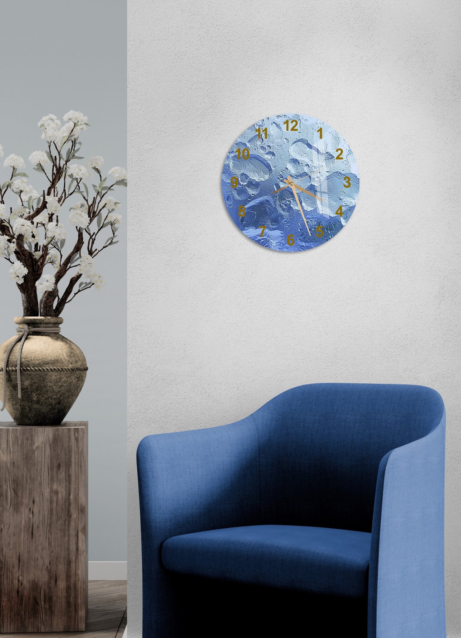 a blue chair sitting next to a clock on a wall