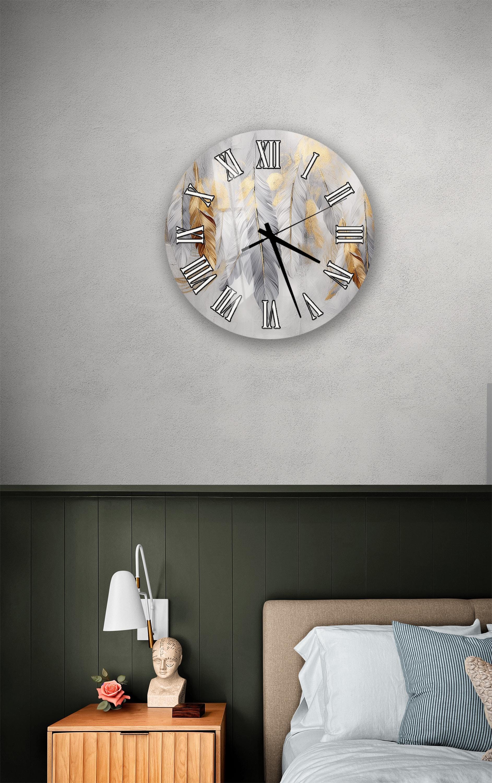 a bedroom setting with a large wall clock displaying Roman numerals, a wooden nightstand with a lamp, and a bed with white bedding.