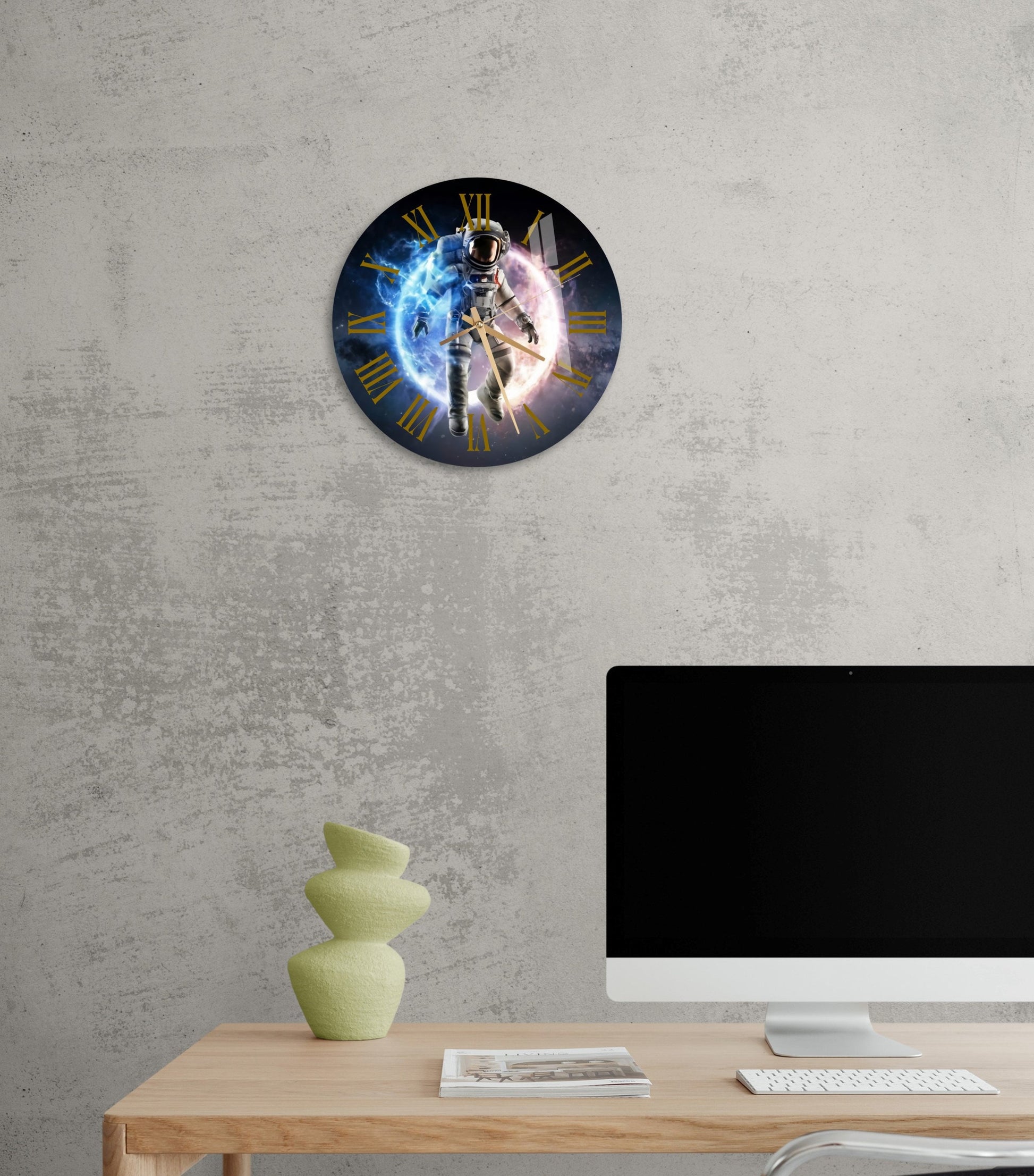 a desk with a computer and a clock on it
