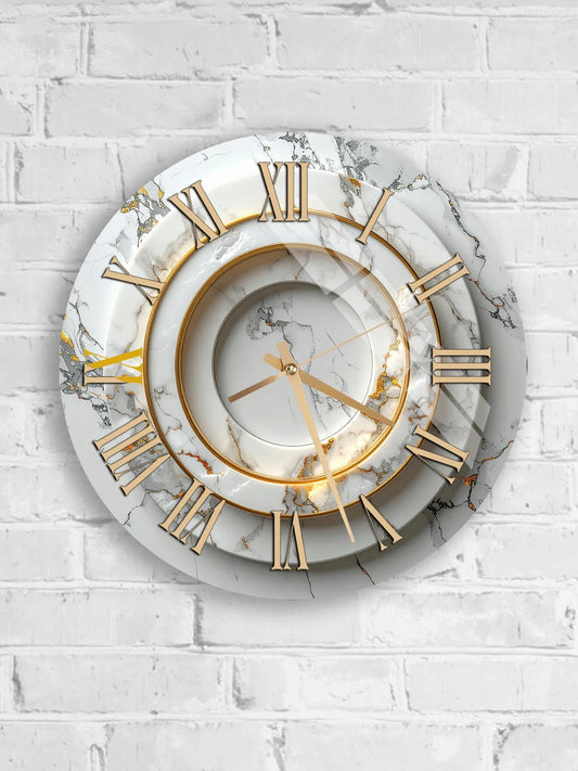 A white marble wall clock with gold Roman numerals and hands.