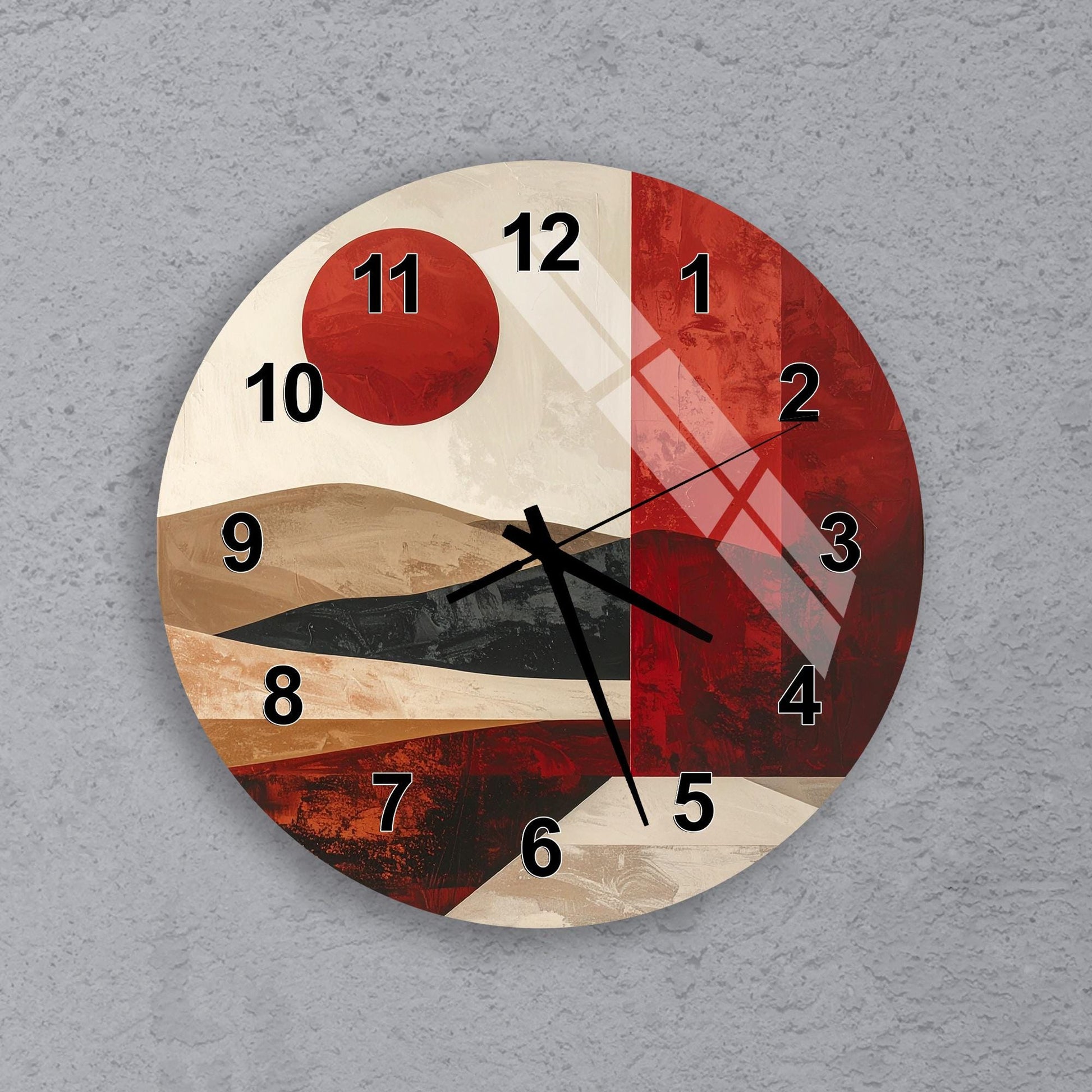 A wall clock with a red and white color scheme, featuring abstract patterns and designs.