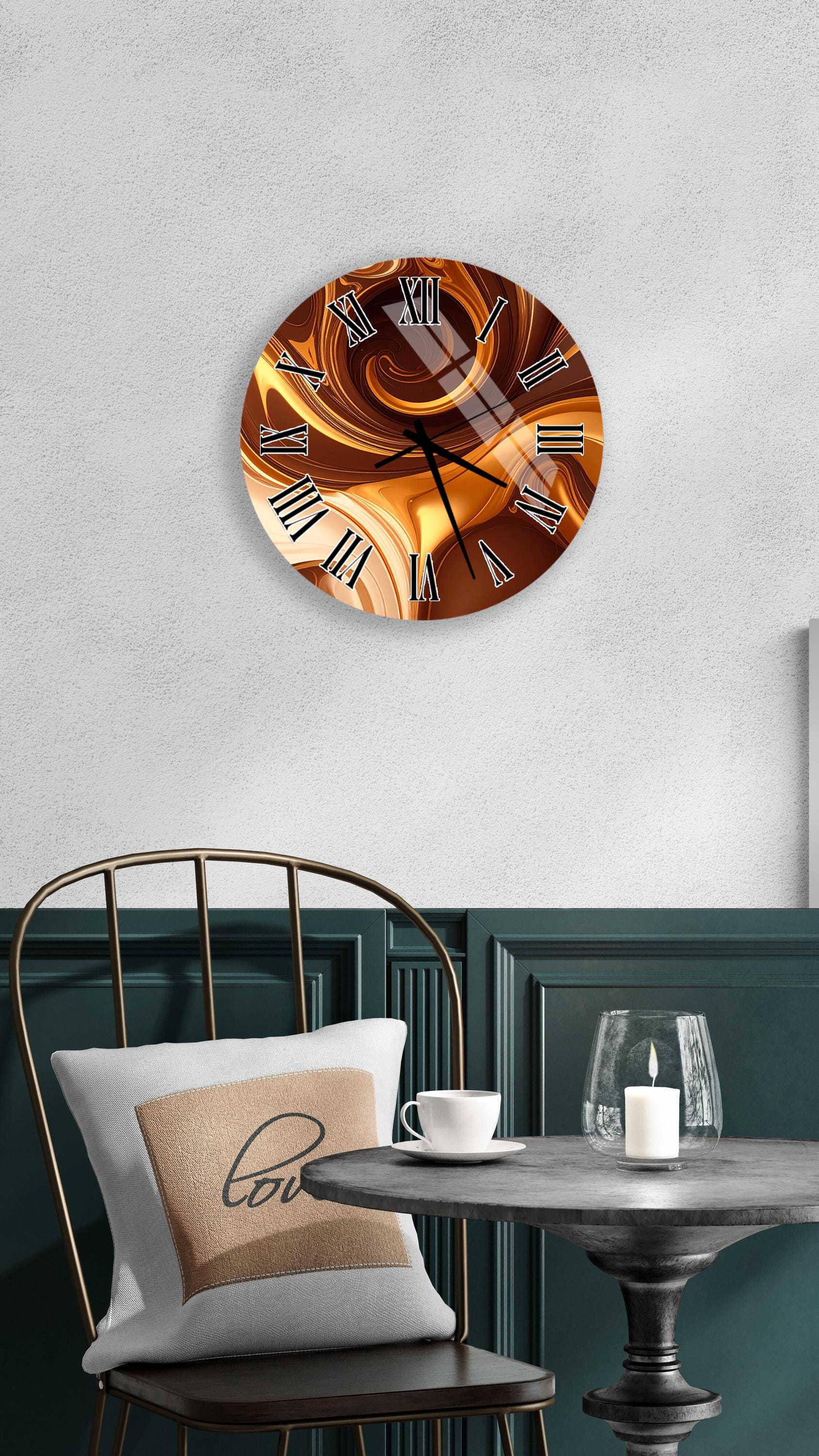 a modern interior design with a round wall clock displaying a swirling pattern in shades of brown and orange. The clock is mounted on a white wall above a black chair with a white pillow. In front of the chair, there is a small table with a glass and a candle, creating a cozy and inviting atmosphere.