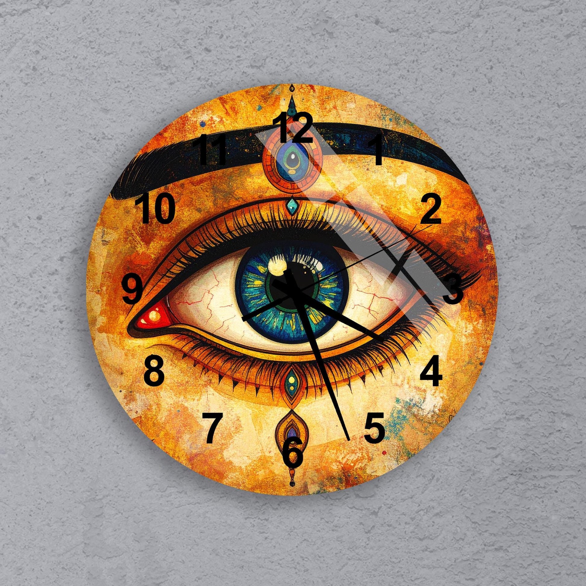 A wall clock with an eye design on the face, featuring a colorful and intricate pattern.