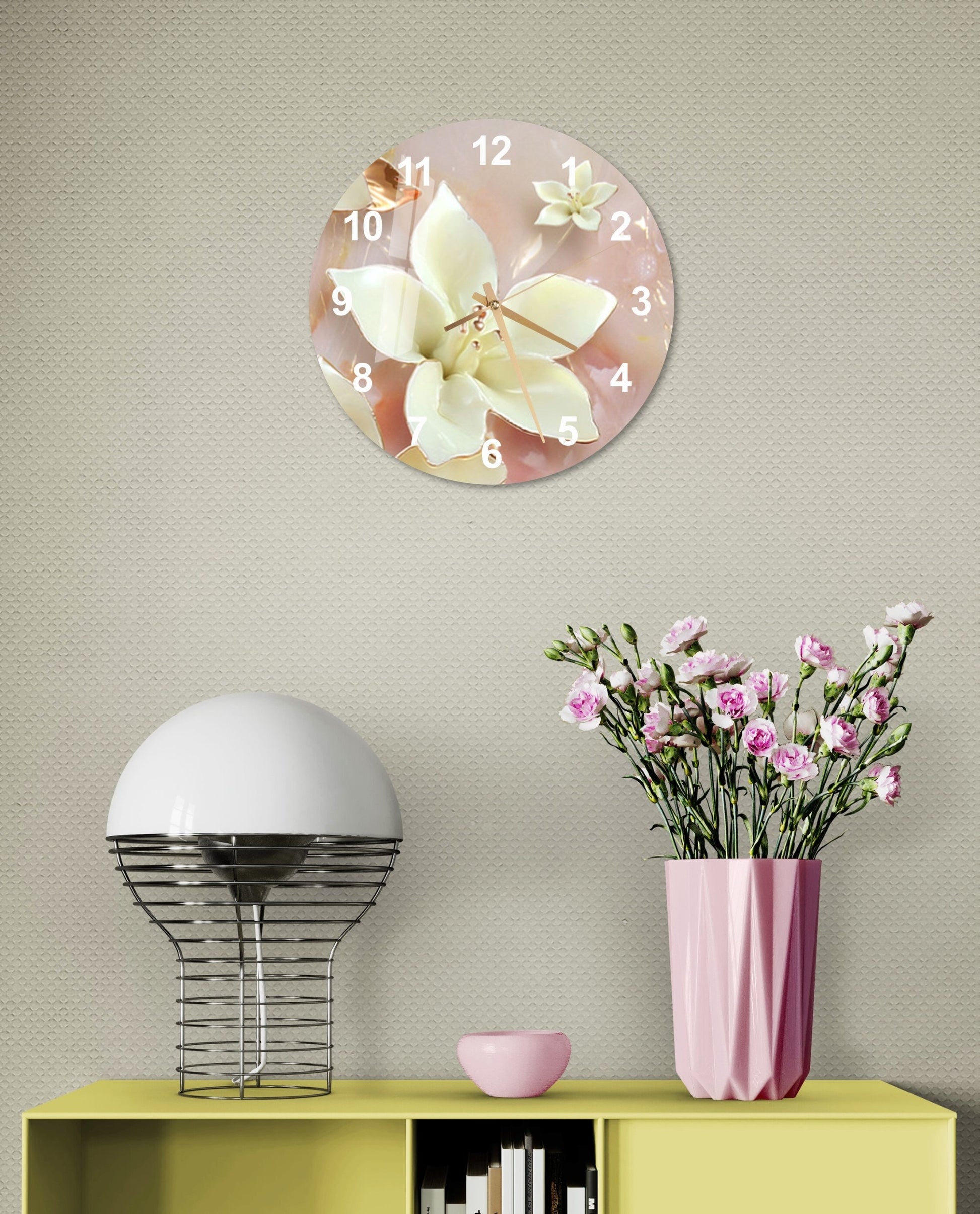 a clock on a wall with flowers in a vase