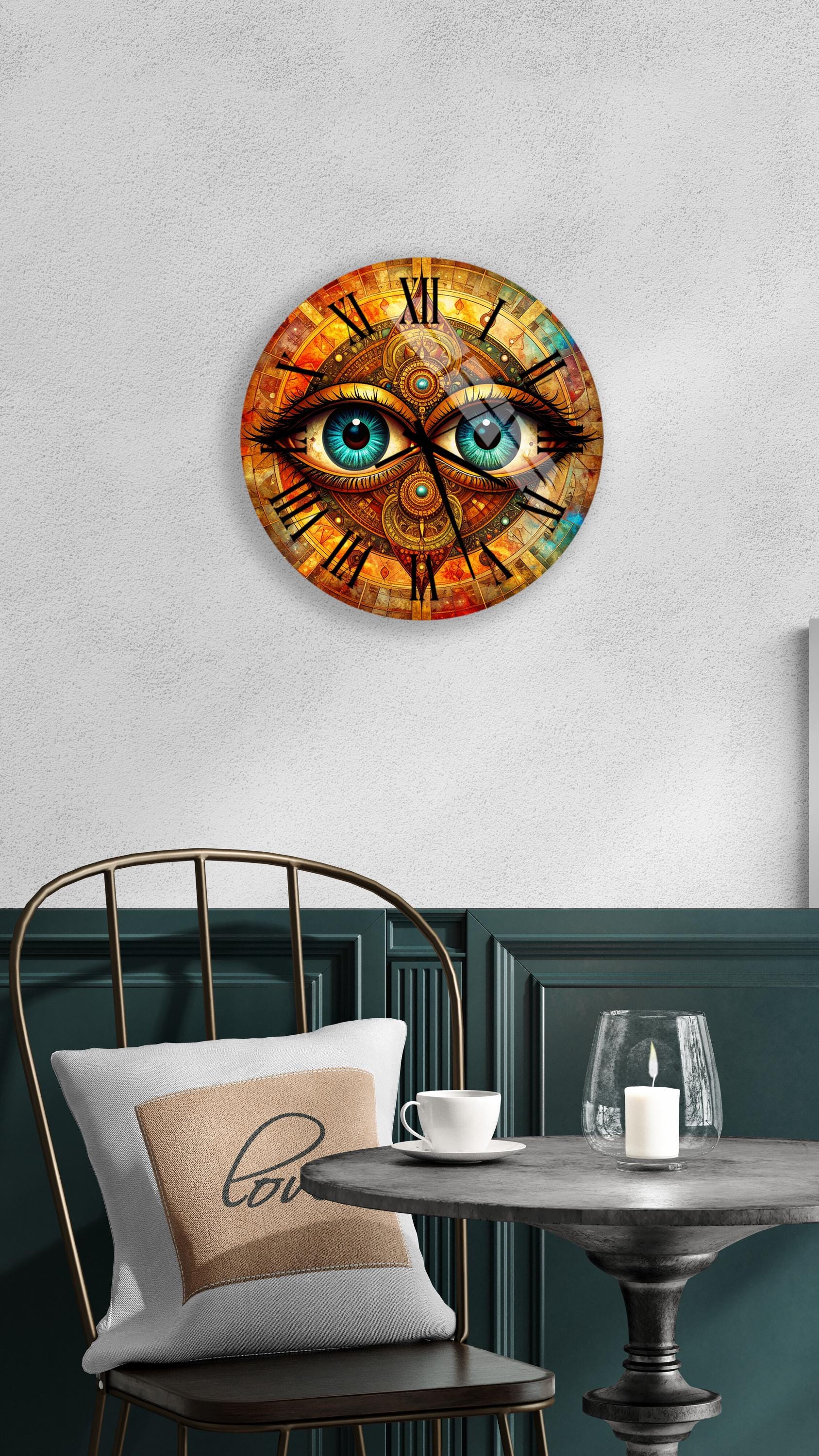 a clock with a unique design, depicting a pair of blue eyes on a clock face. The clock is mounted on a wall above a table with a white tablecloth and a candle on it.