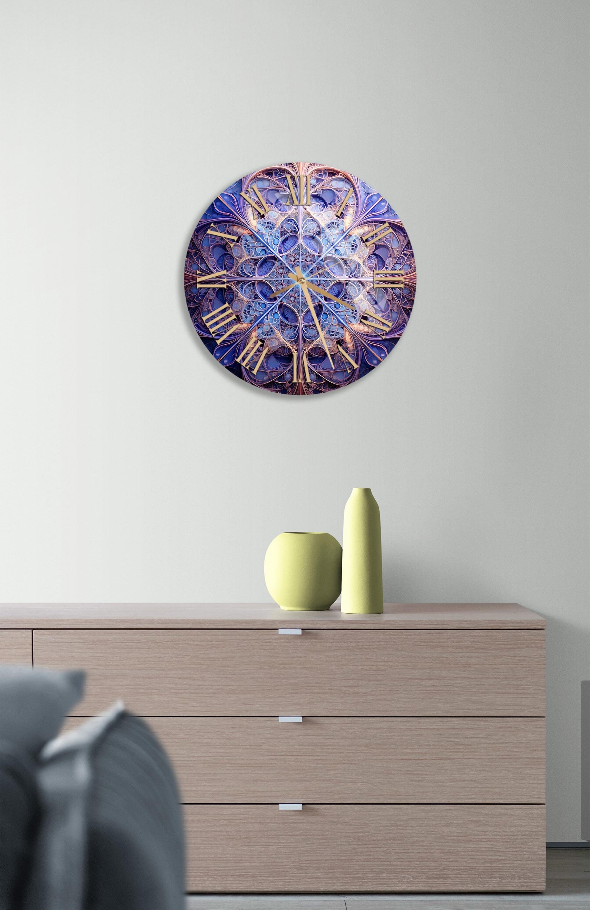 a clock on a wall above a dresser