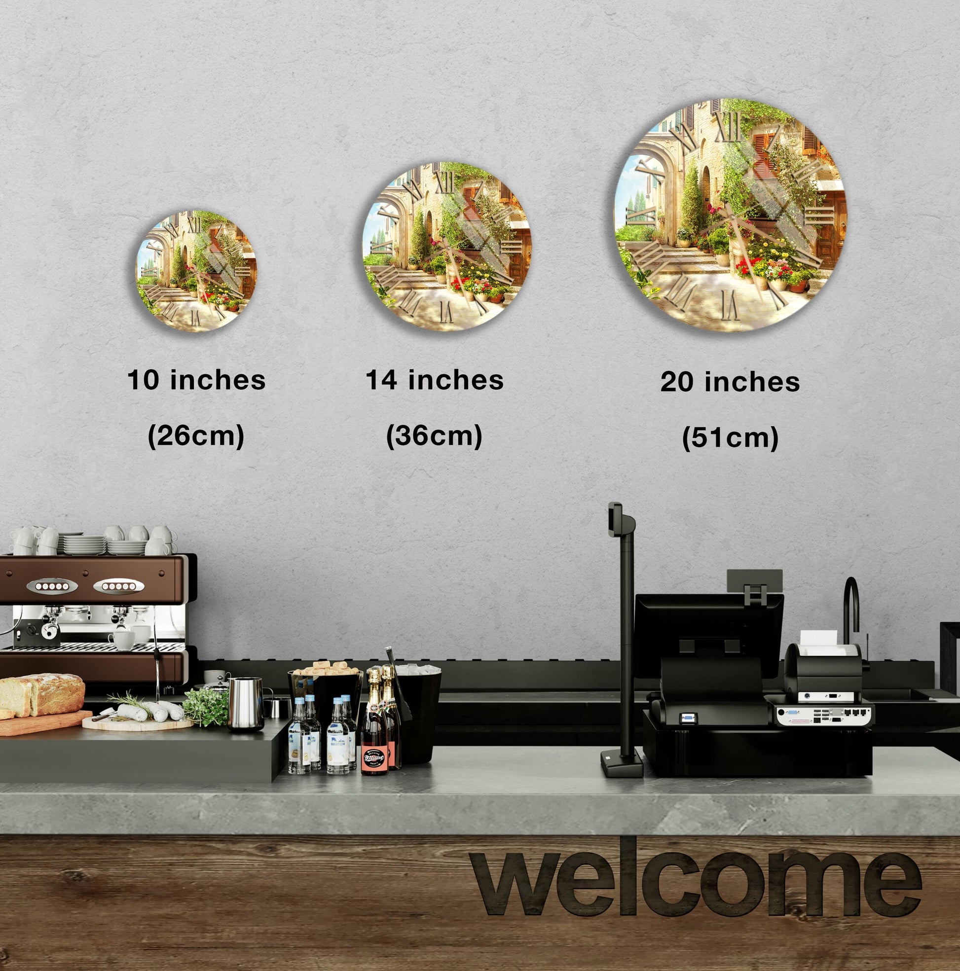 a counter with a cash register, a coffee machine, and various food items such as bottles and bread. Above the counter, there are three clock-like images of different sizes, indicating the time in inches. The counter also has a "welcome" sign, suggesting a welcoming atmosphere in the space.