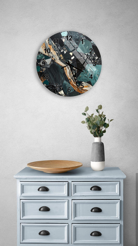 a wall clock with a marble-like design, a wooden bowl, and a vase with greenery on a light blue dresser.