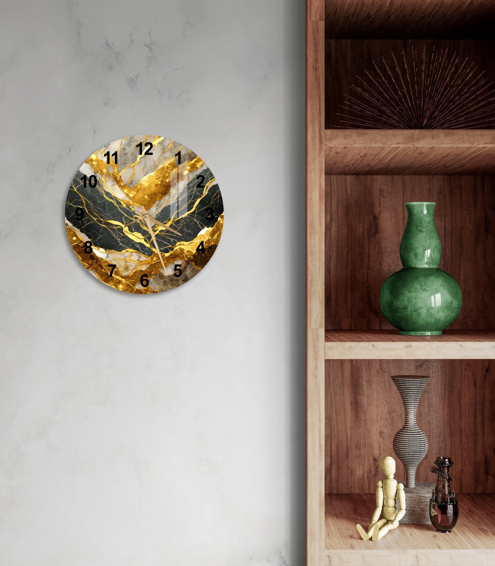 a wall clock with a gold leaf design on it
