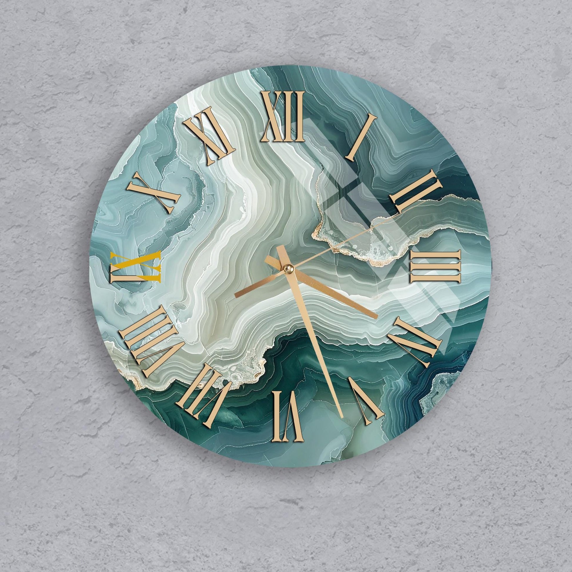 A round clock with a marble-like design on its face, featuring Roman numerals and gold hands.