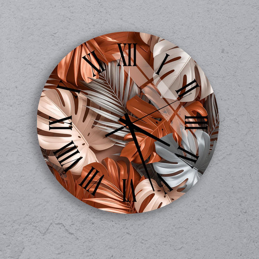 a round clock with a design of leaves and flowers on its face.