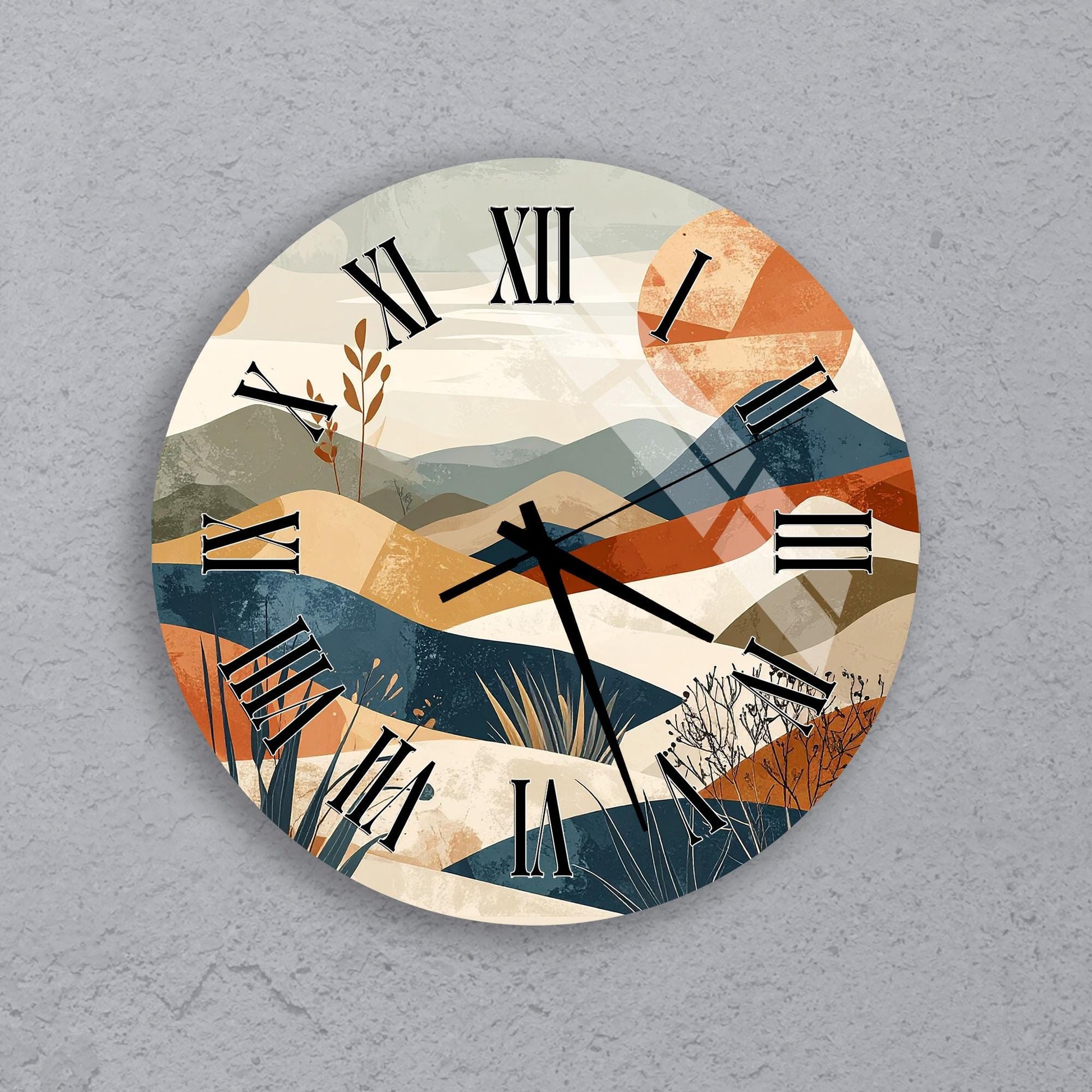 a round clock with a landscape design on its face, depicting mountains, grass, and a sun.