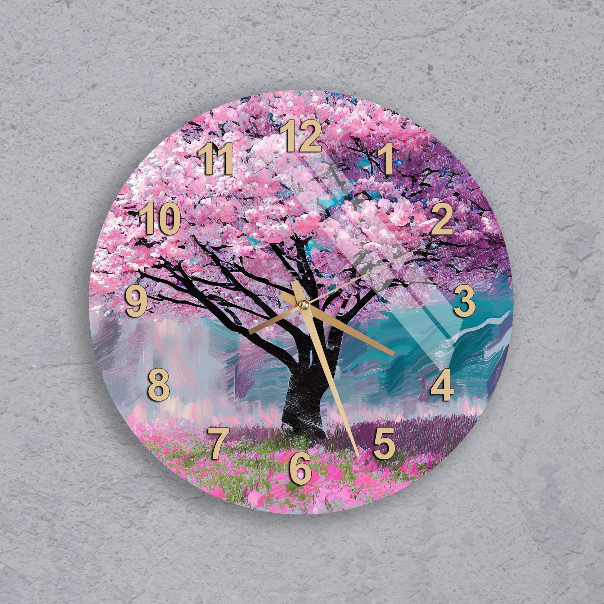A wall clock with a pink tree and purple flowers on its face, set against a blue sky background.