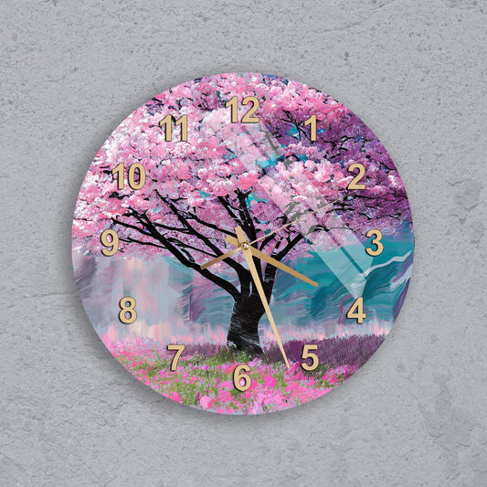 A wall clock with a pink tree and purple flowers on its face, set against a blue sky background.