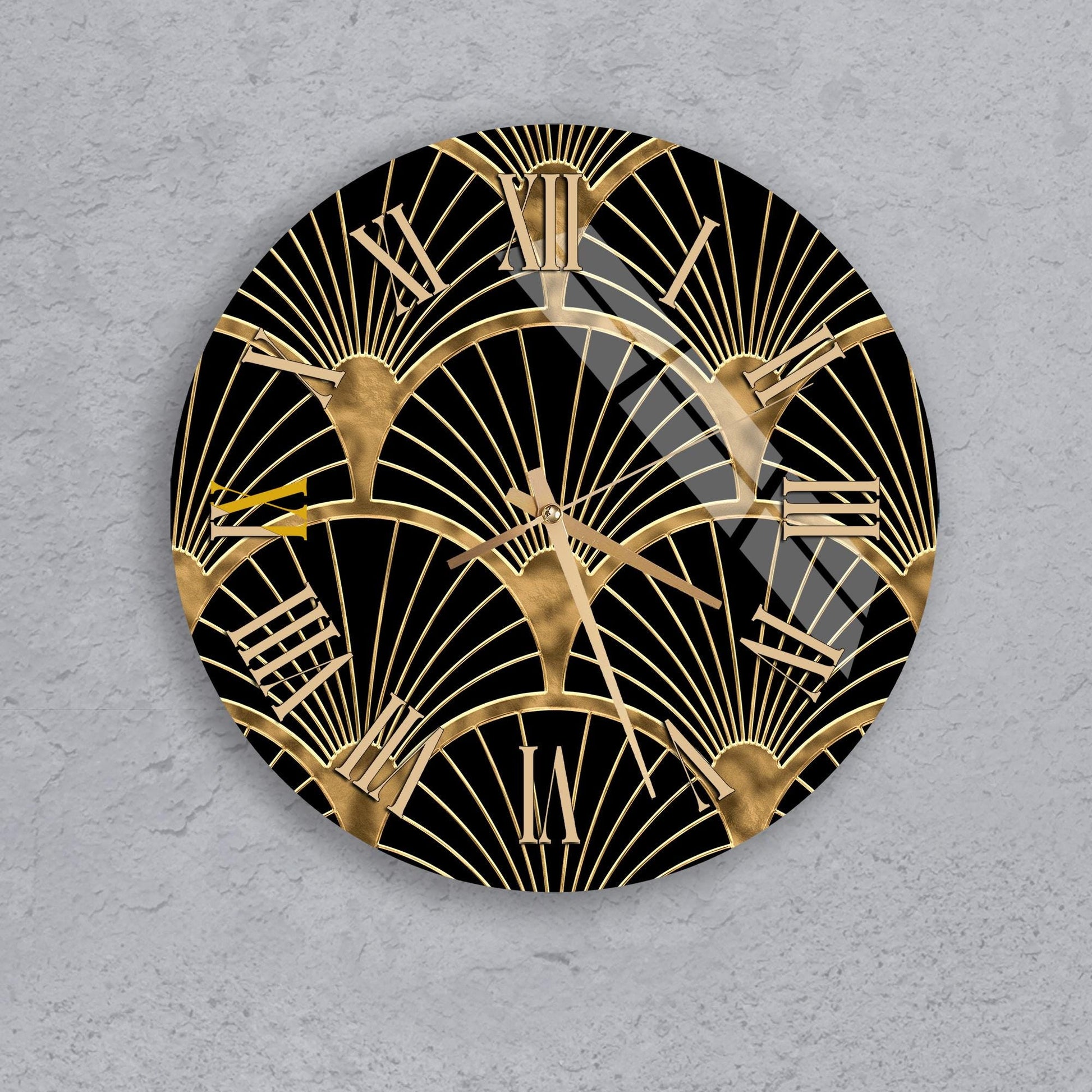 a round clock with a black and gold design, including a repeating pattern of golden rays or lines.