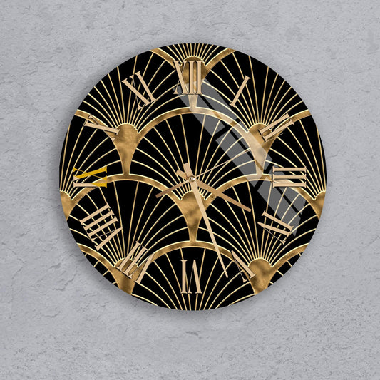 a round clock with a black and gold design, including a repeating pattern of golden rays or lines.