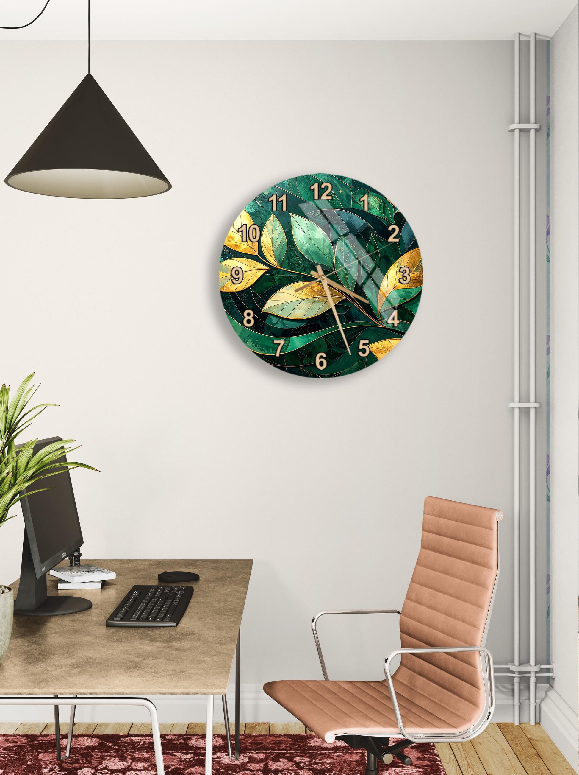 a modern office space with a large wall clock displaying a green and yellow leaf design, a wooden desk with a computer setup, and a brown leather office chair.