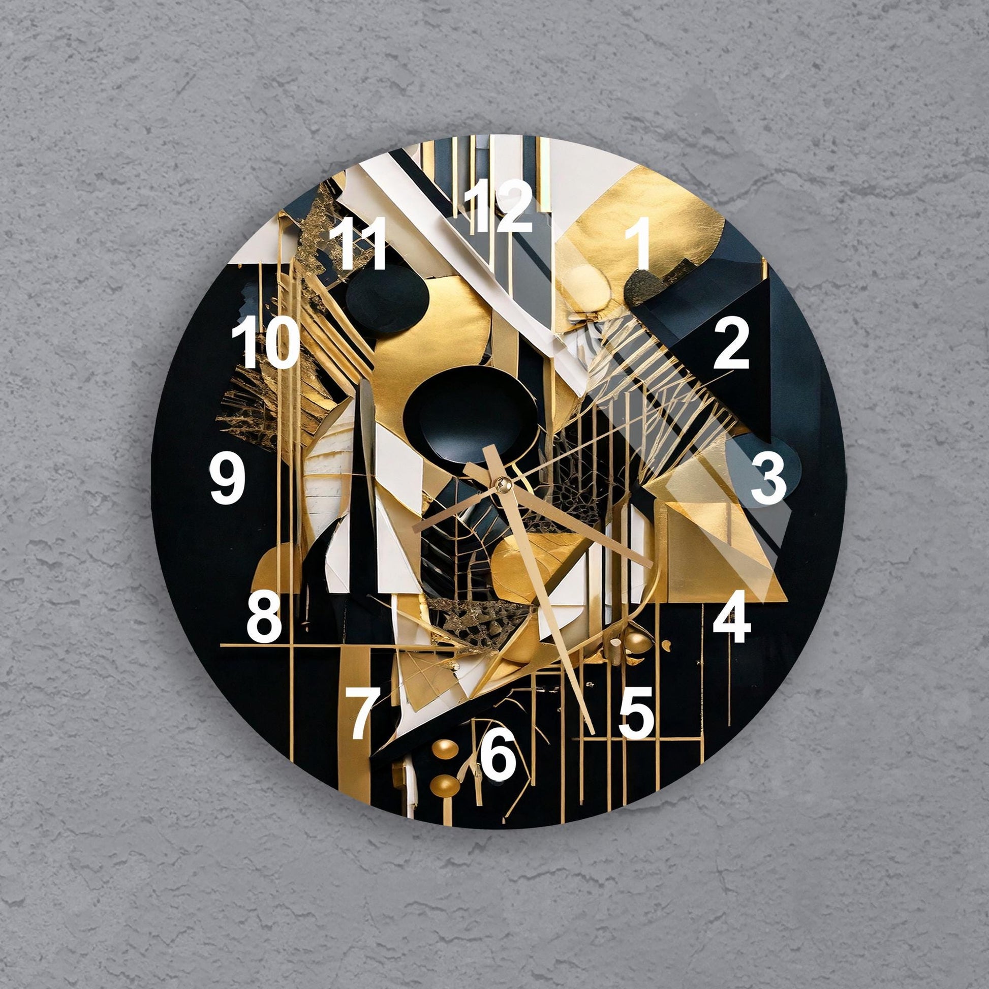 a black and gold clock on a gray wall