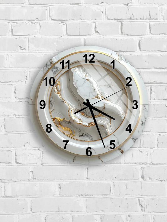 A white wall clock with a marble-like design and gold accents.