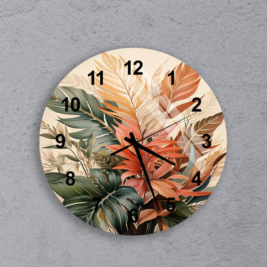 a clock with a painting of leaves on it
