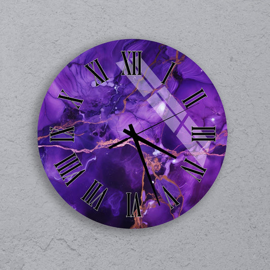 A round wall clock with a purple marble-like design and gold accents.