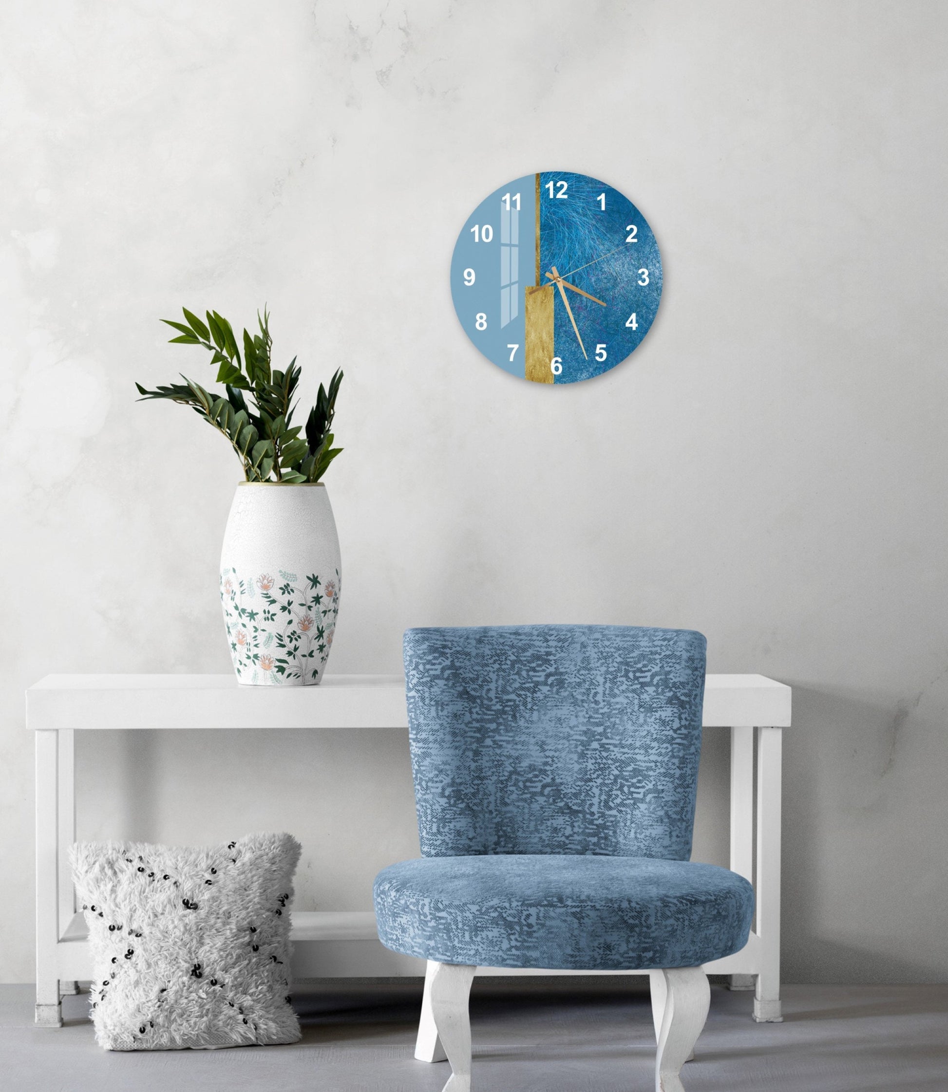 a blue chair sitting next to a white table