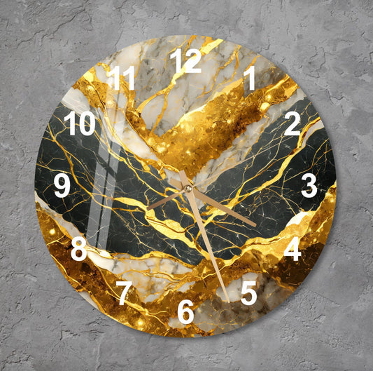 a clock with a gold leaf design on it
