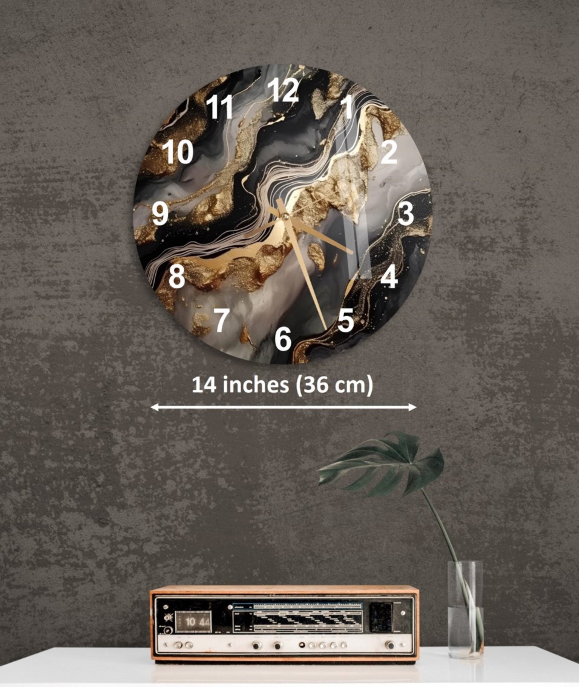 a wall clock with a black and white marble design