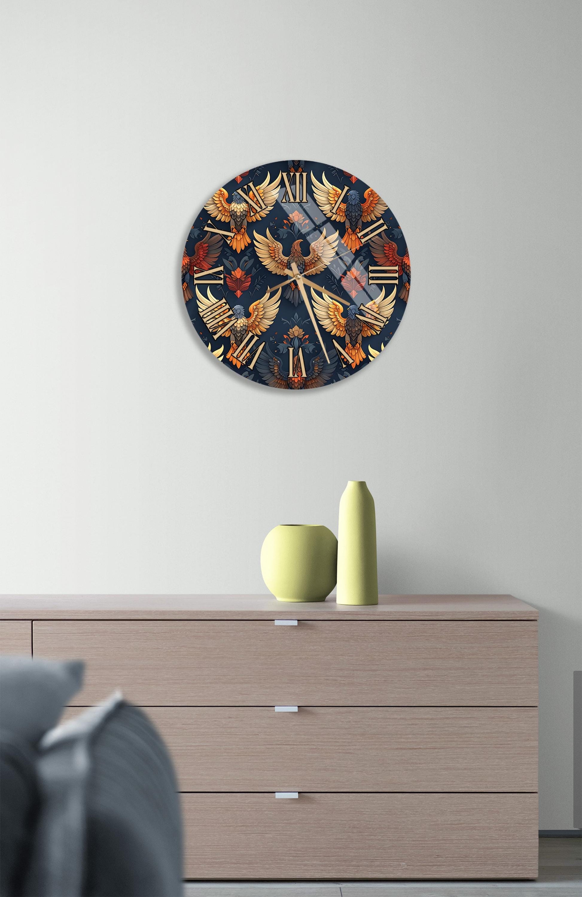 a wall clock with a vibrant, colorful design, hanging on a wall above a wooden dresser.
