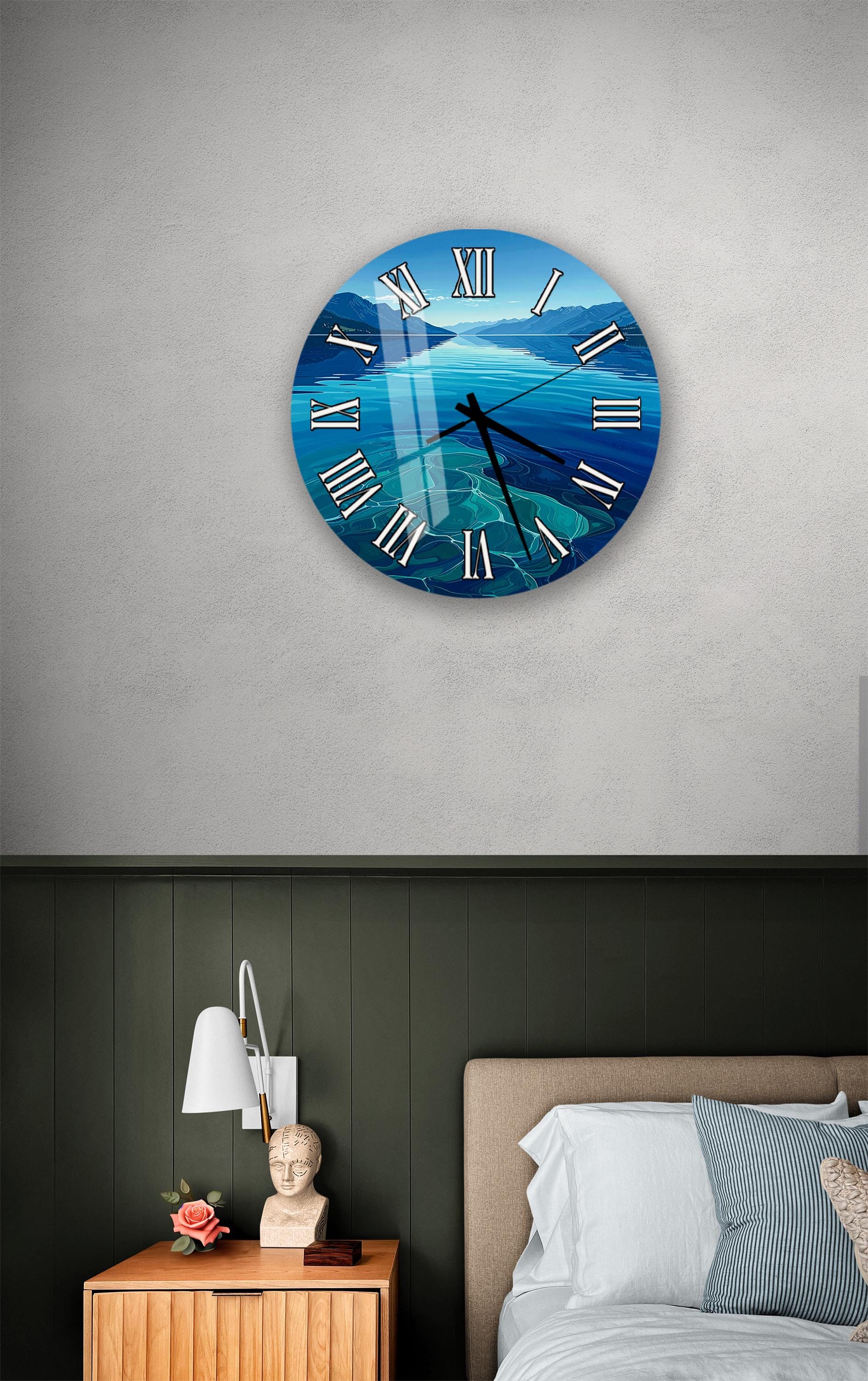 a bedroom setting with a wall clock displaying a serene image of a body of water, possibly a lake or ocean, with mountains in the background. The clock is mounted on a wall above a bed with a wooden headboard.