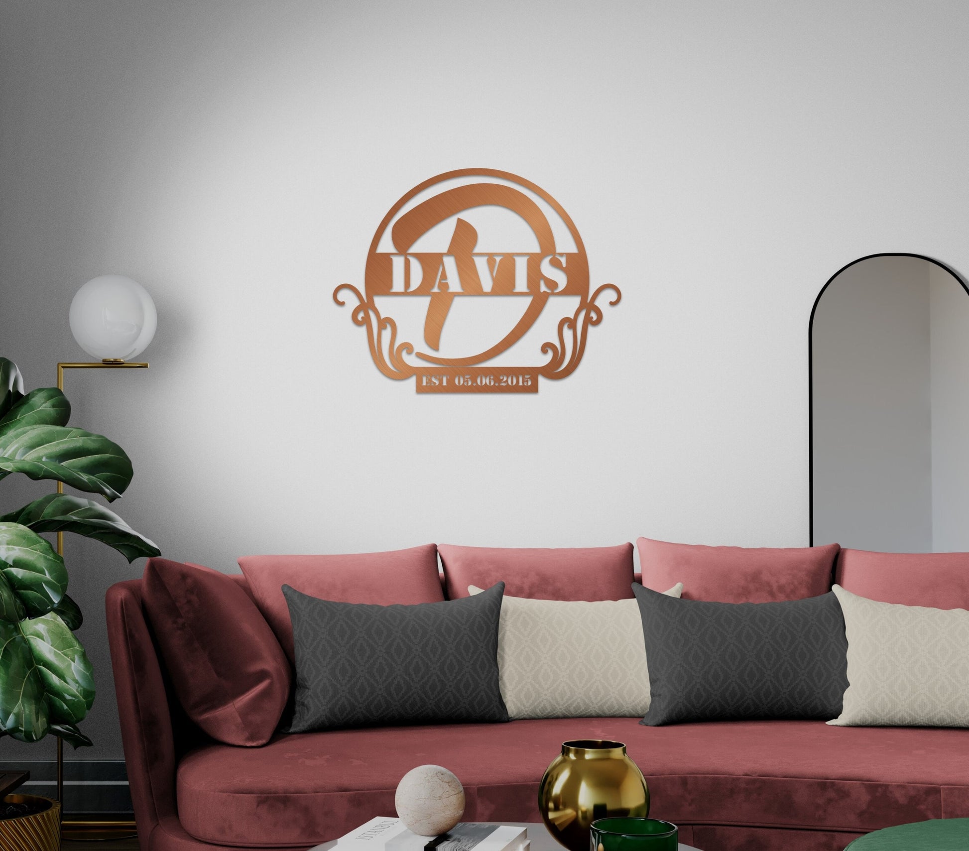 a living room with a red couch and a mirror