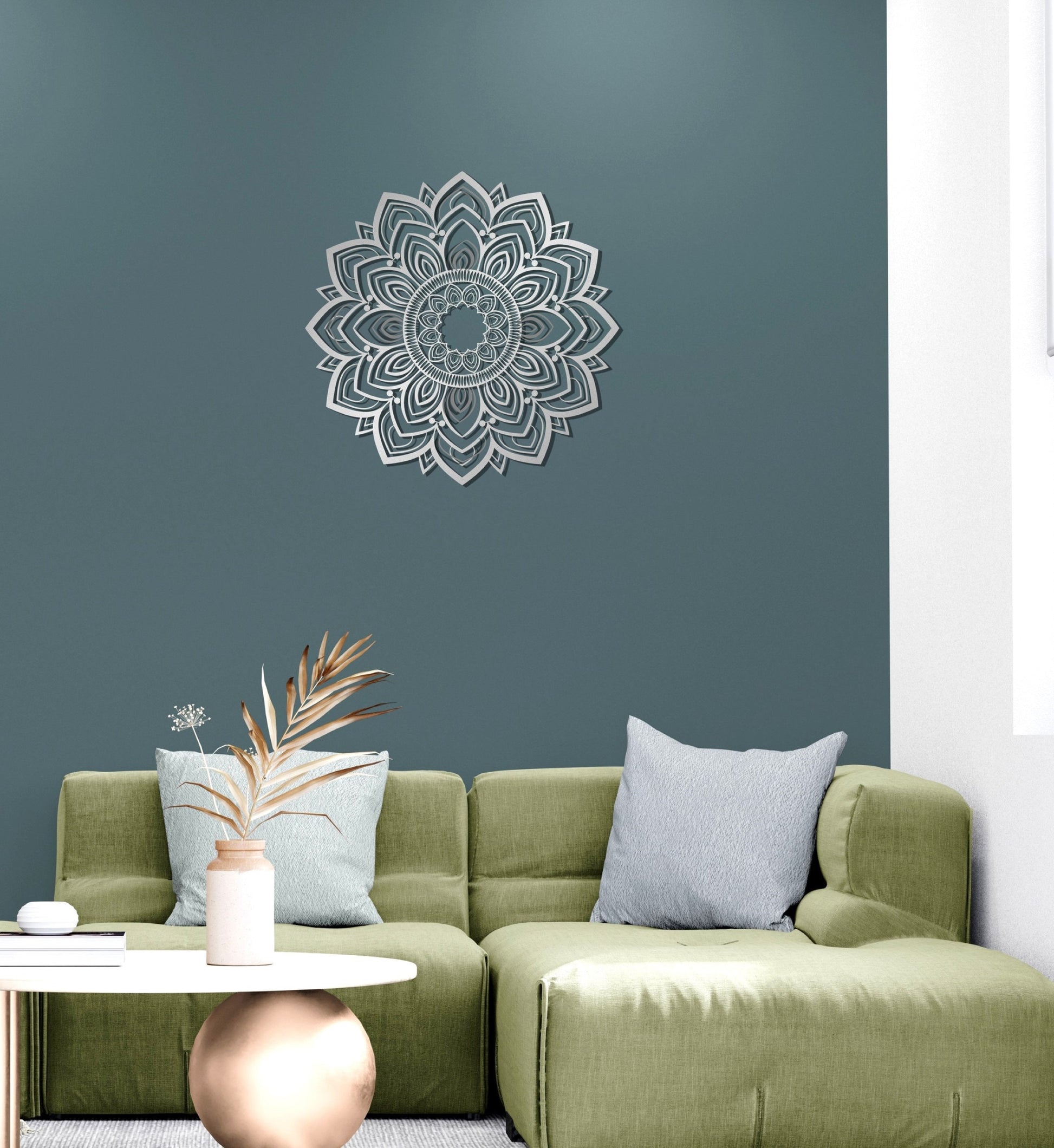 a living room with a green couch and a white table