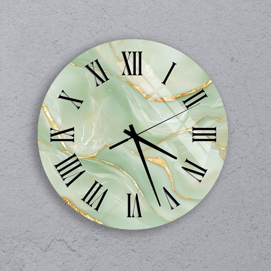 A round wall clock with a marble-like green and gold color scheme, featuring Roman numerals and hands.