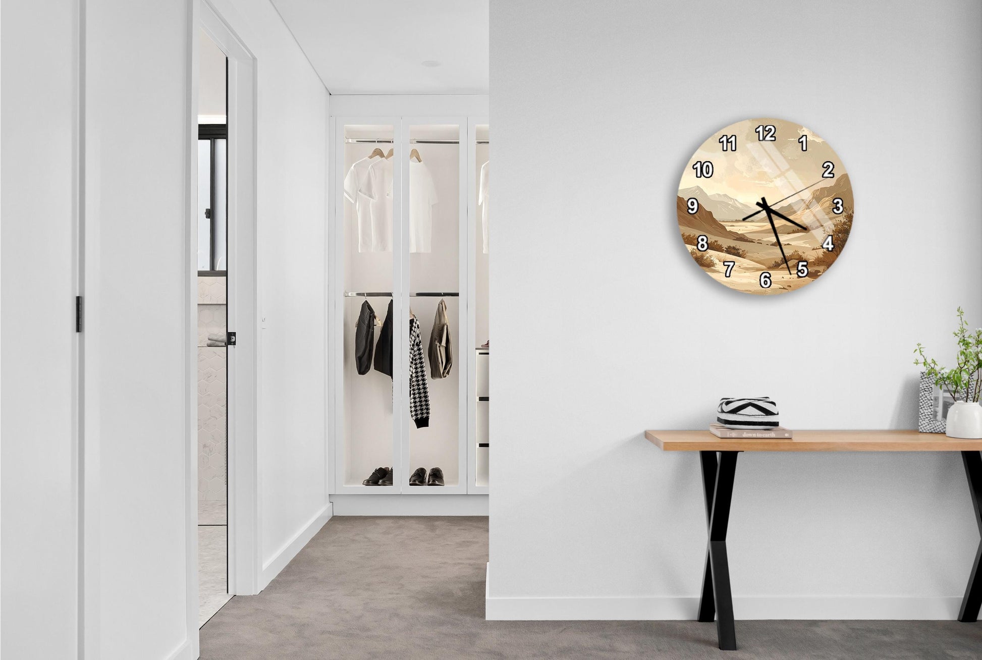 a modern hallway with a large wall clock, a wooden console table, and a closet with hanging clothes.