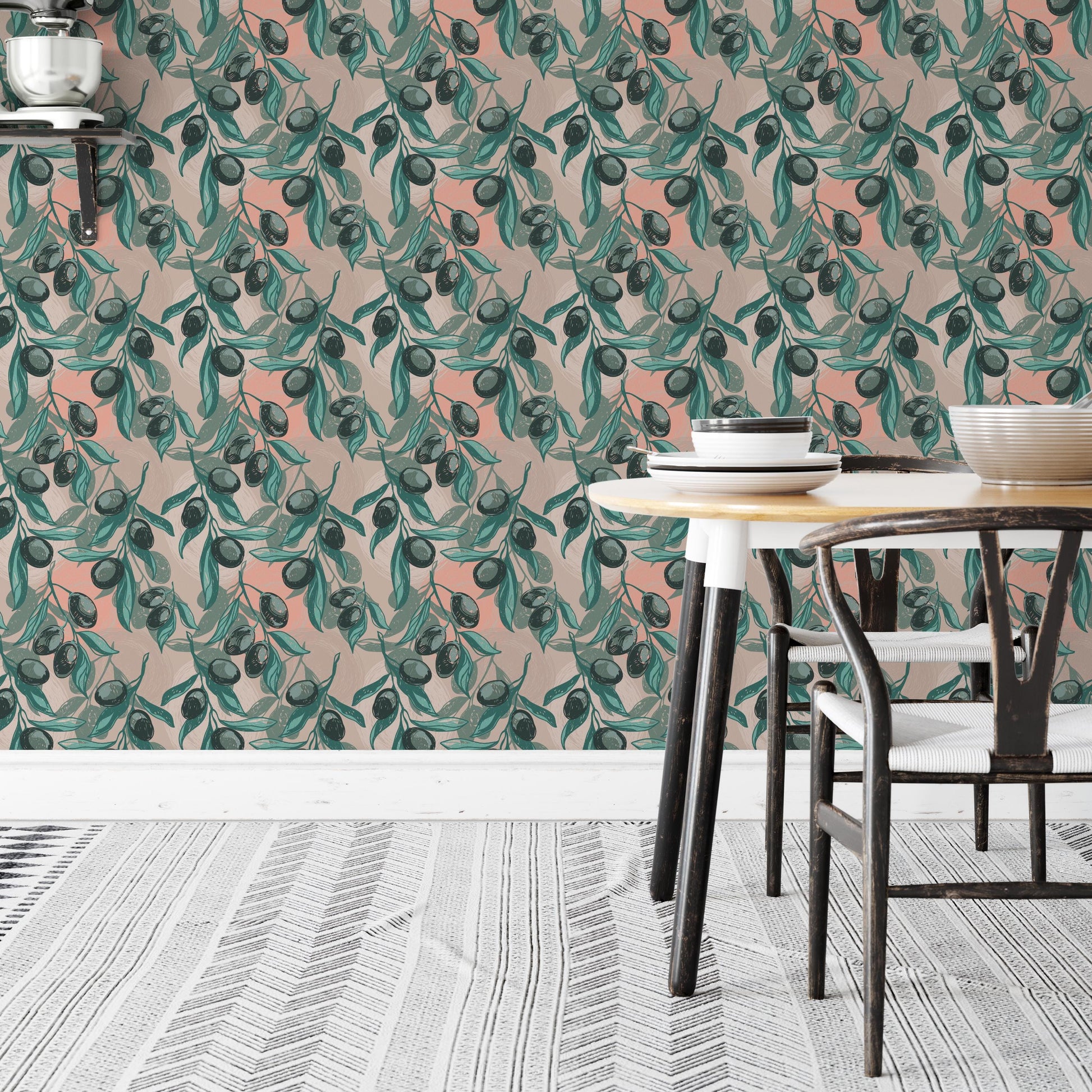 a dining area with a table and chairs, set against a wall with a vibrant, repeating pattern of green leaves and orange fruit. The table is set with plates and bowls, creating a cozy and inviting atmosphere.