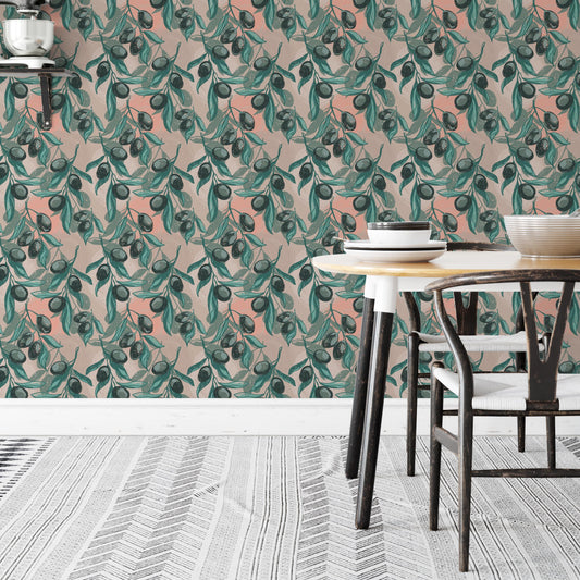 a dining area with a table and chairs, set against a wall with a vibrant, repeating pattern of green leaves and orange fruit. The table is set with plates and bowls, creating a cozy and inviting atmosphere.