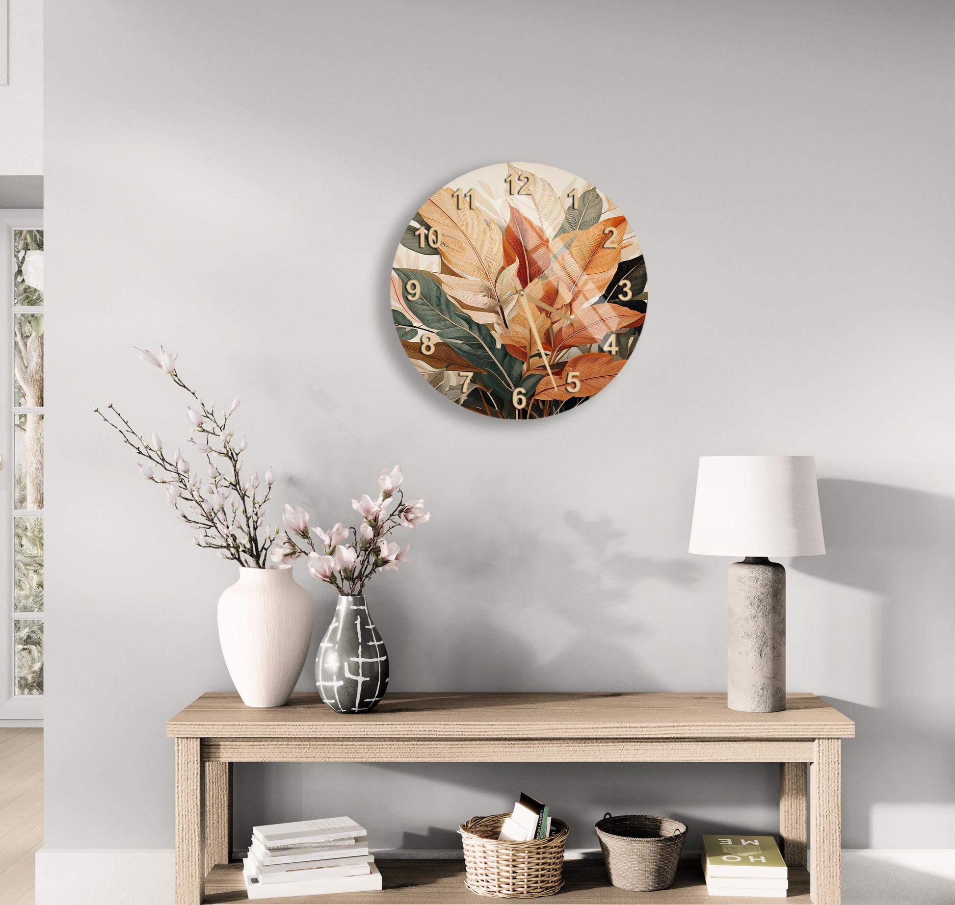 a clock on the wall above a table with a vase of flowers