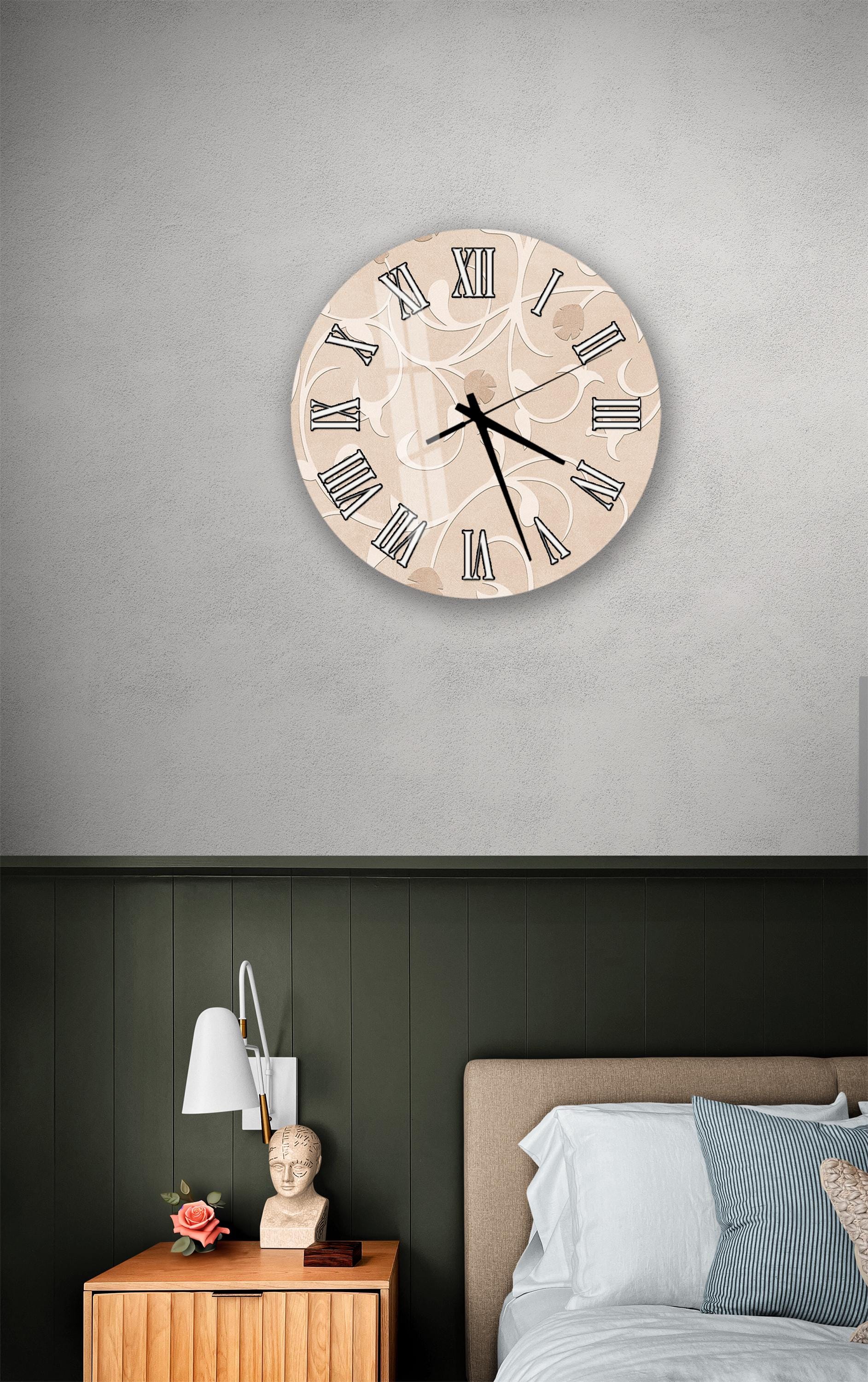 a bedroom setting with a wall clock, a nightstand, and a bed.