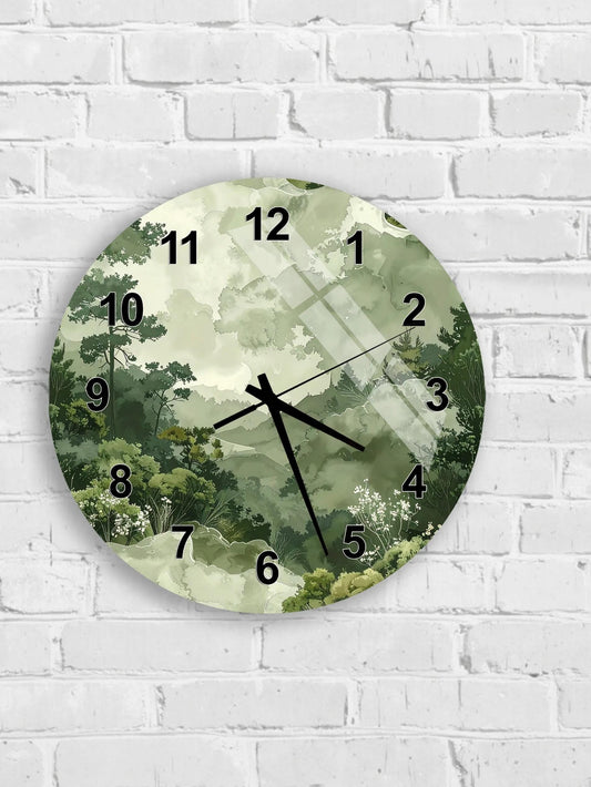 A wall clock with a green forest landscape design on its face.
