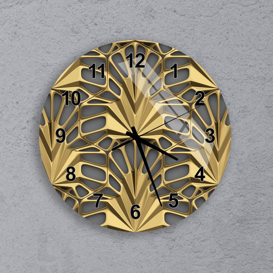 A gold-colored wall clock with a unique, geometric design and black hands indicating the time.