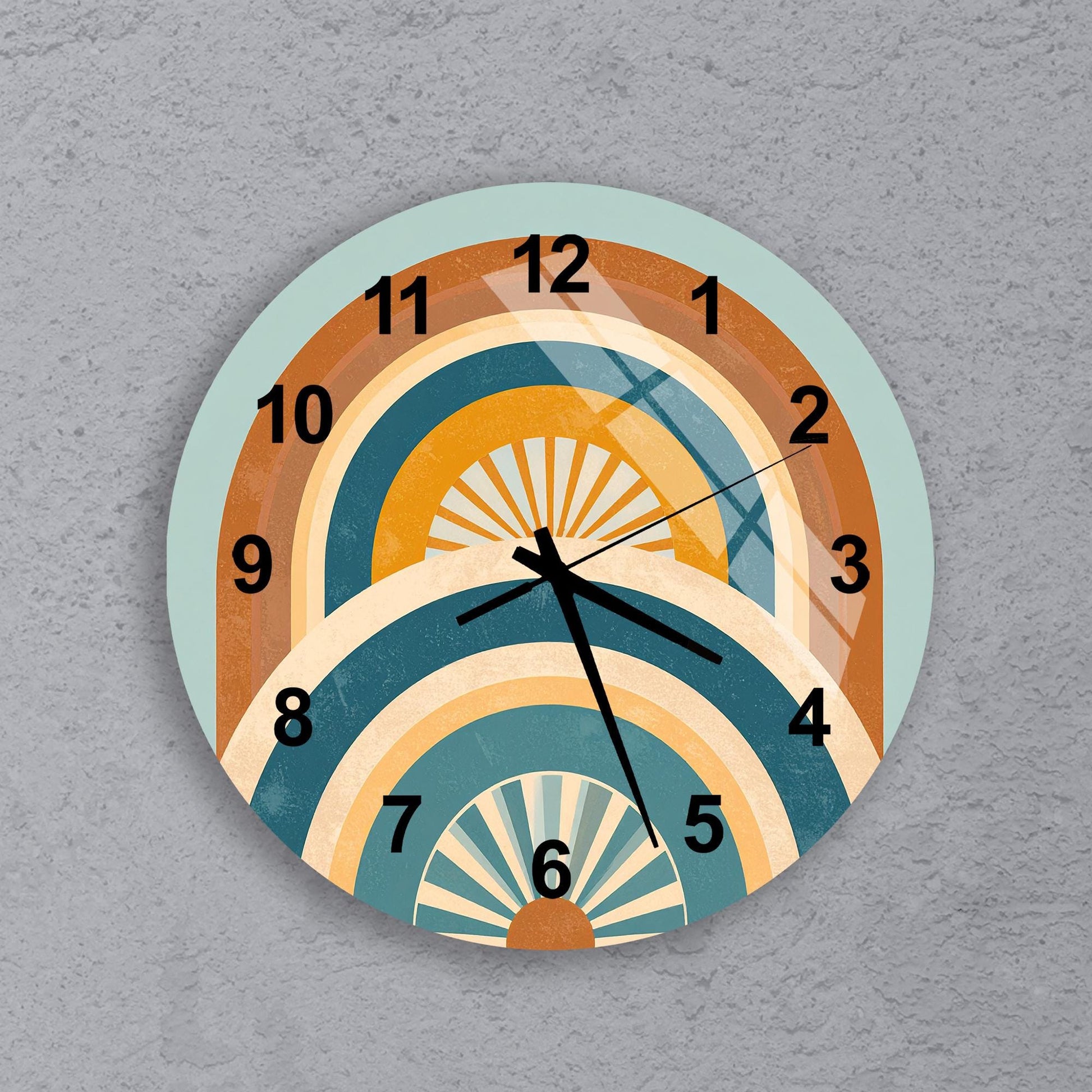 A wall clock with a colorful, abstract design featuring various shades of orange, yellow, and blue.
